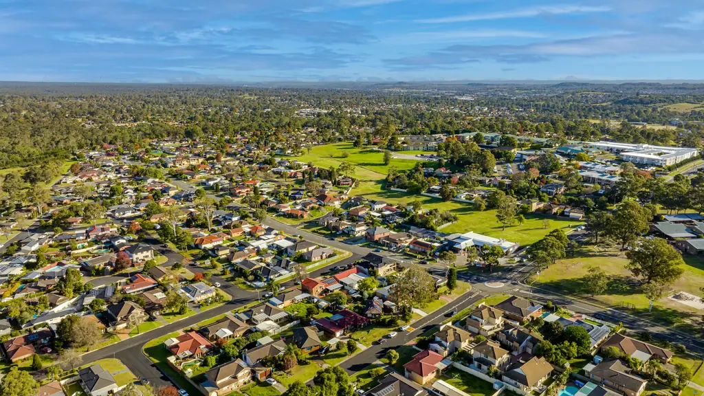 Aerial view of a leafy Sydney suburb with bushland stretching to the horizon